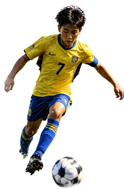 Young footballer in yellow kit dribbling a ball